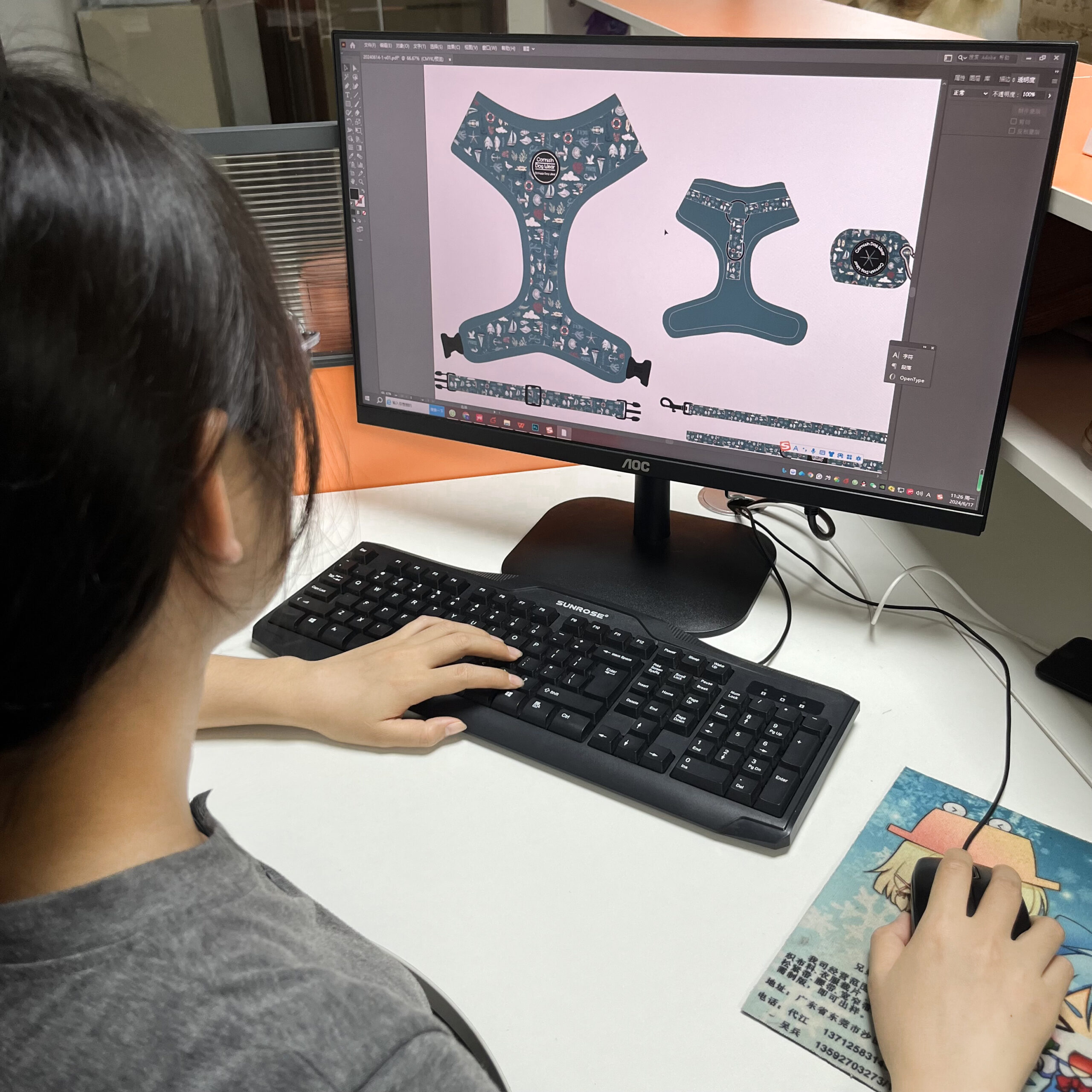 A designer sketching a new style of dog harness on a tablet
