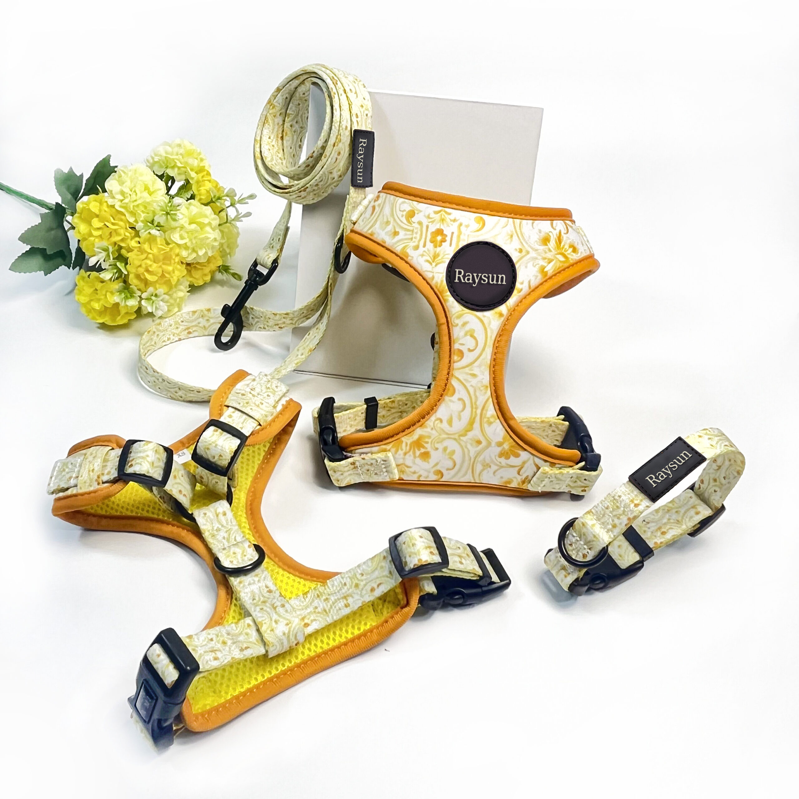 A close-up view of the features on a heavy-duty dog harness: wide straps, strong buckles, and metal D-rings